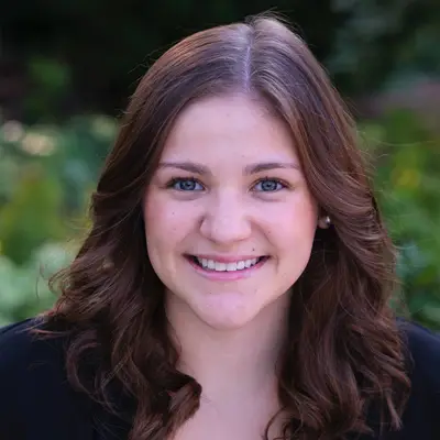 A photo of Megan Tinerella outside.