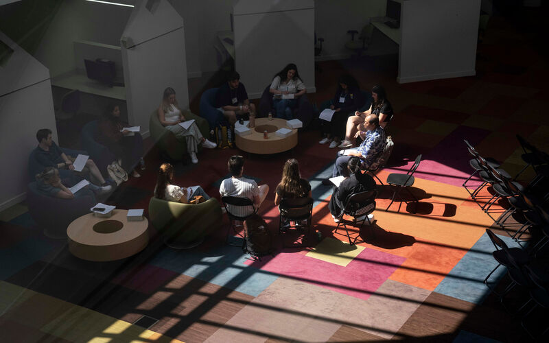 Students talking in a circle