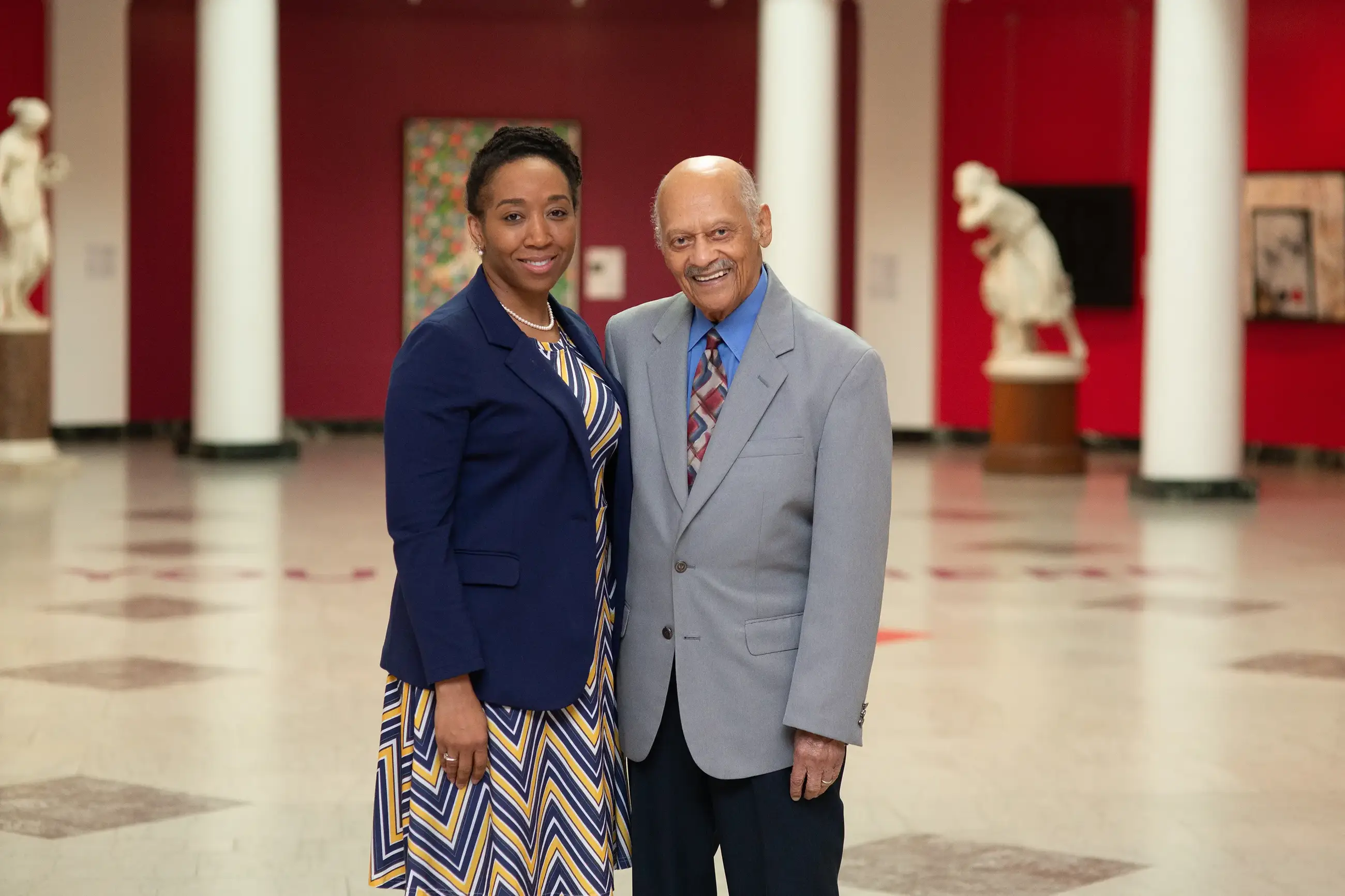 Dr. Watkins and Dr. Curtis standing next to each other in an art gallery.