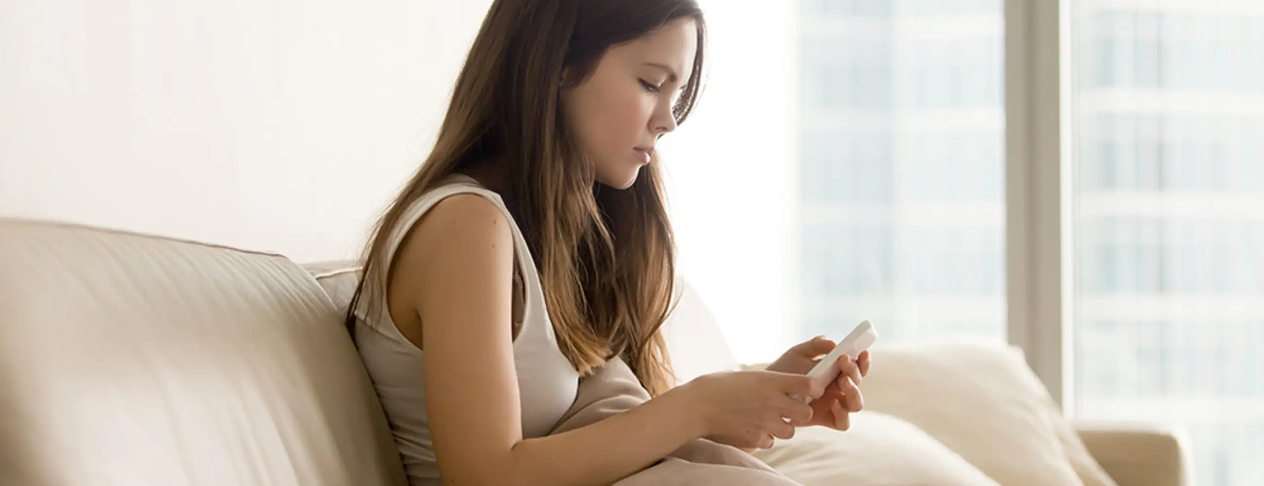 Teenager looking at a phone