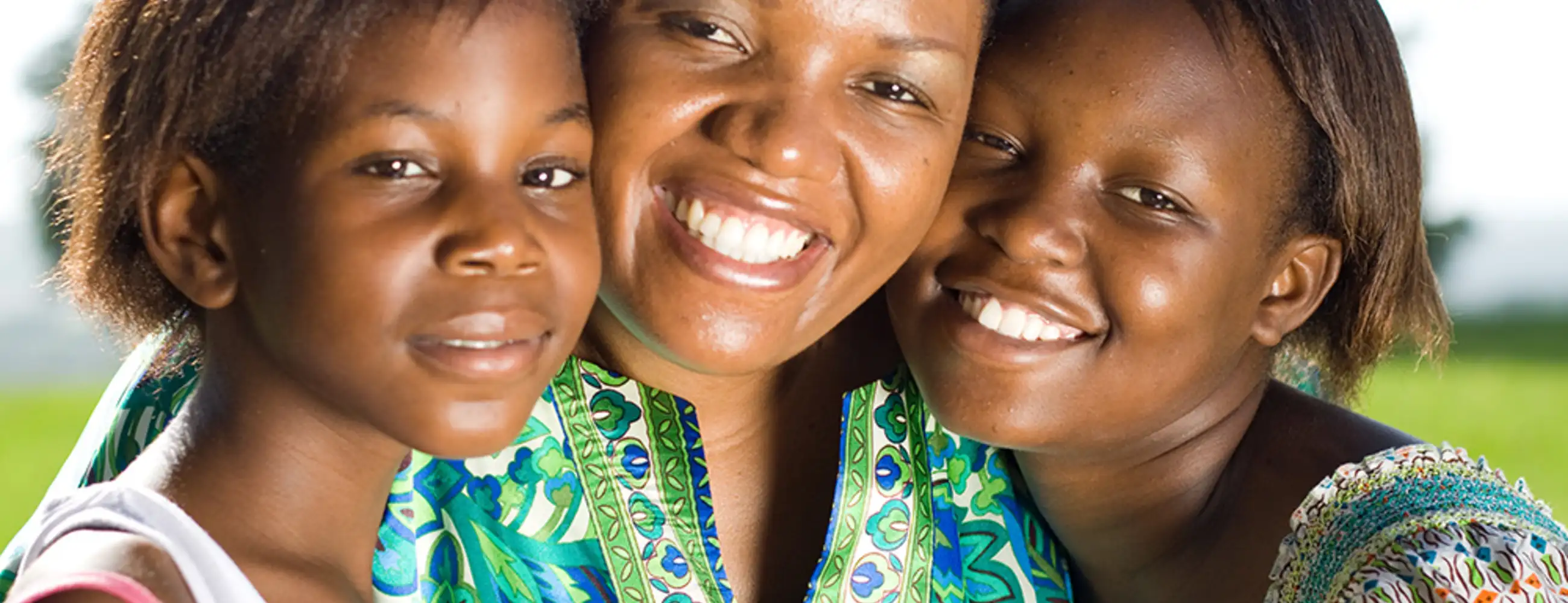 Three people smiling