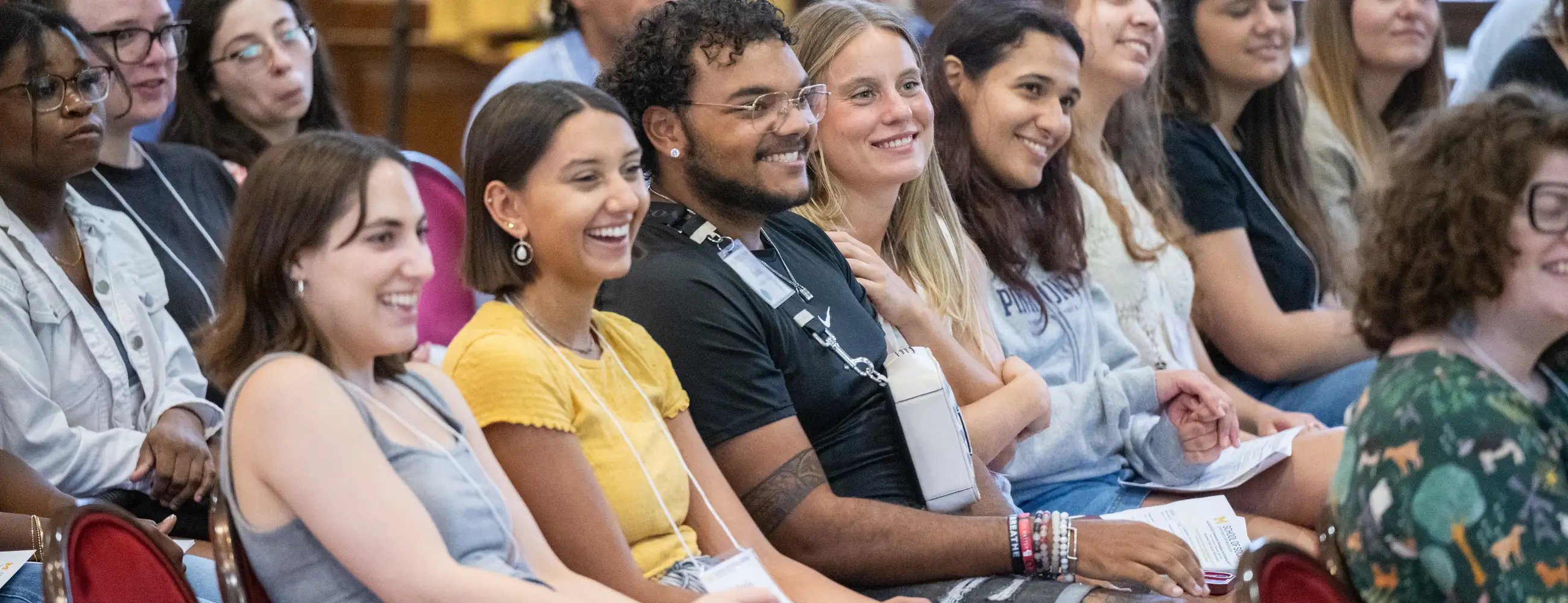 Students sitting together smiling