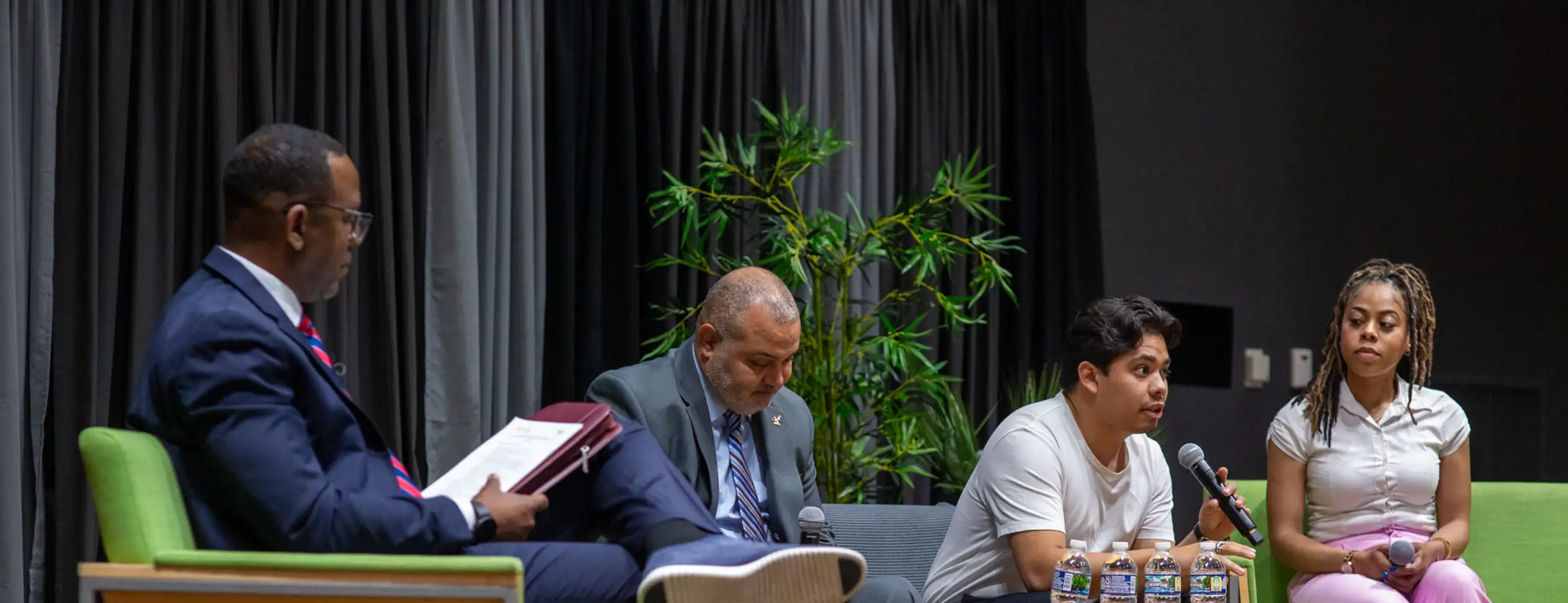 4 people on a panel talking