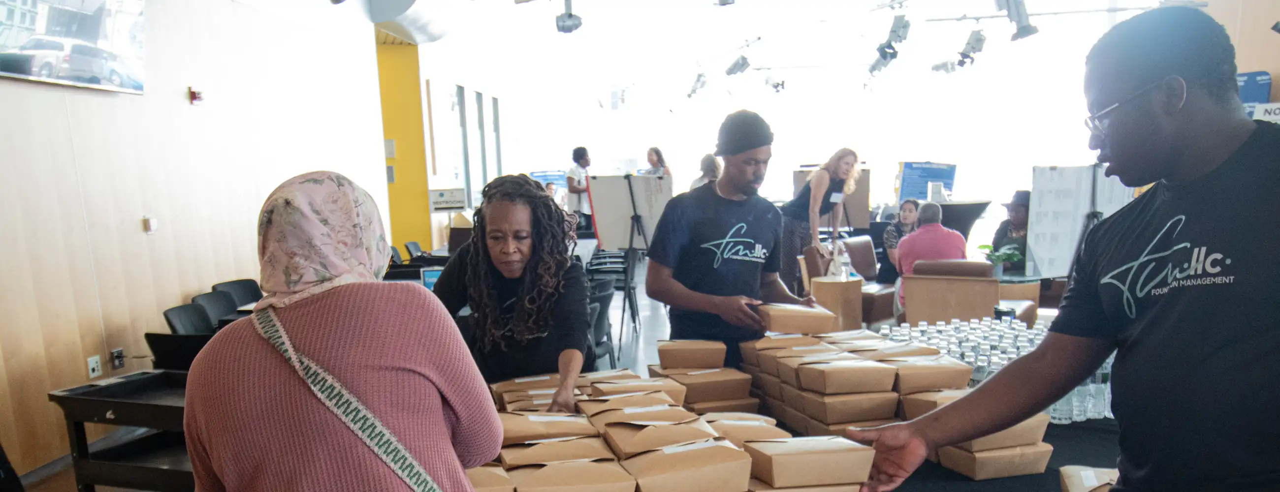 People handing out food at an event