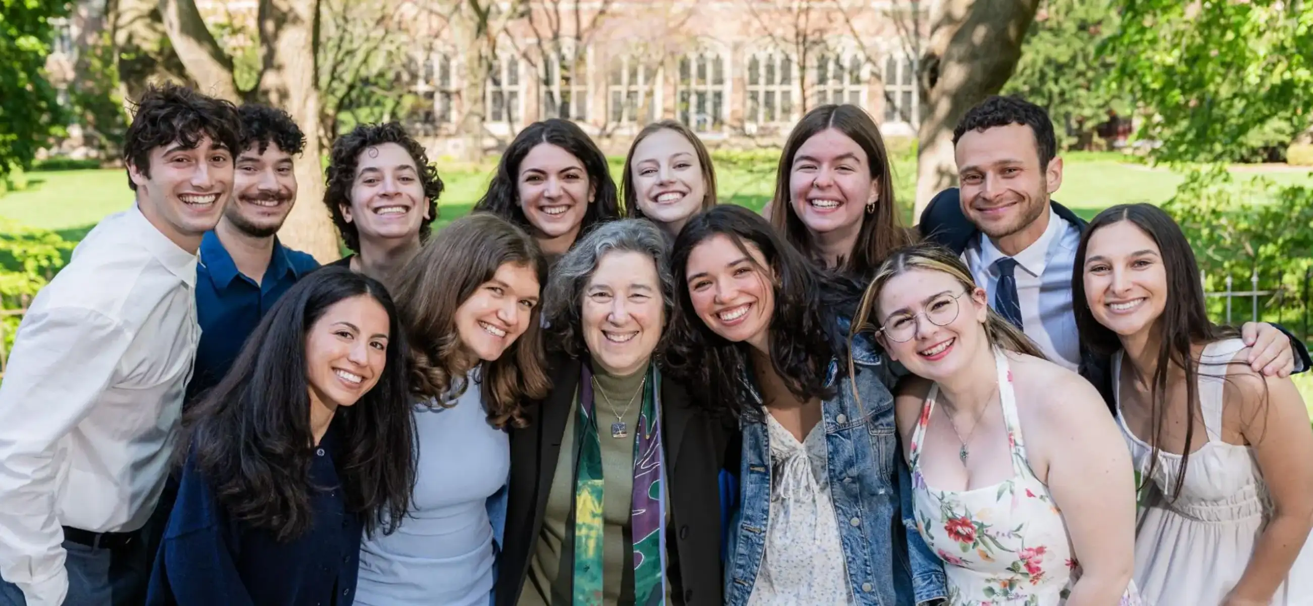 Members of the 2025-2026 JCLP cohort smiling together outdoors on a sunny campus lawn.