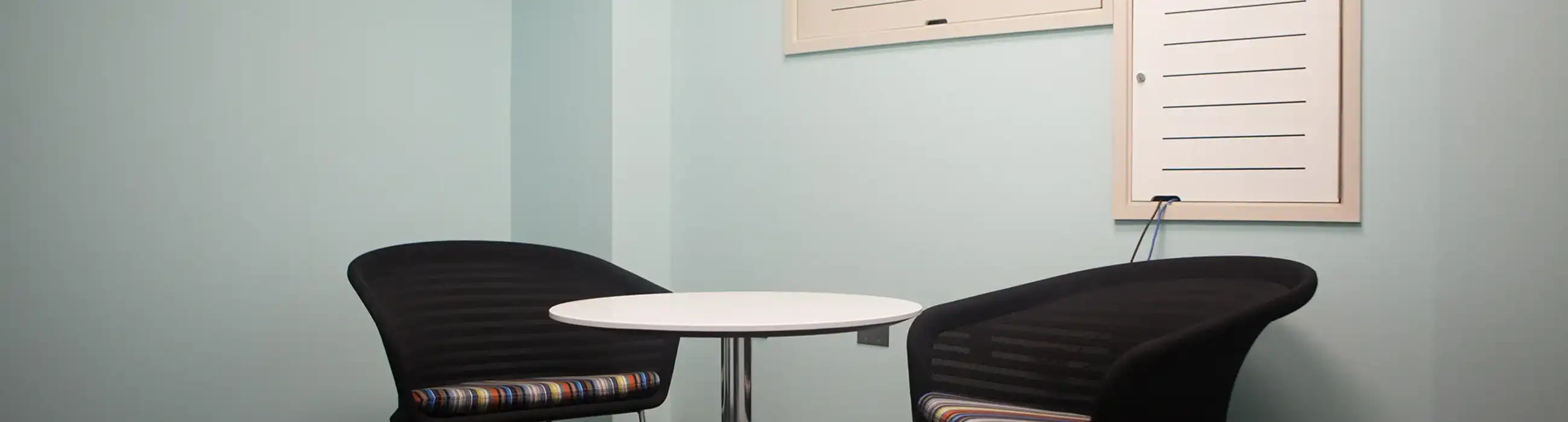 Photo of the reflection room with two chairs and a table.