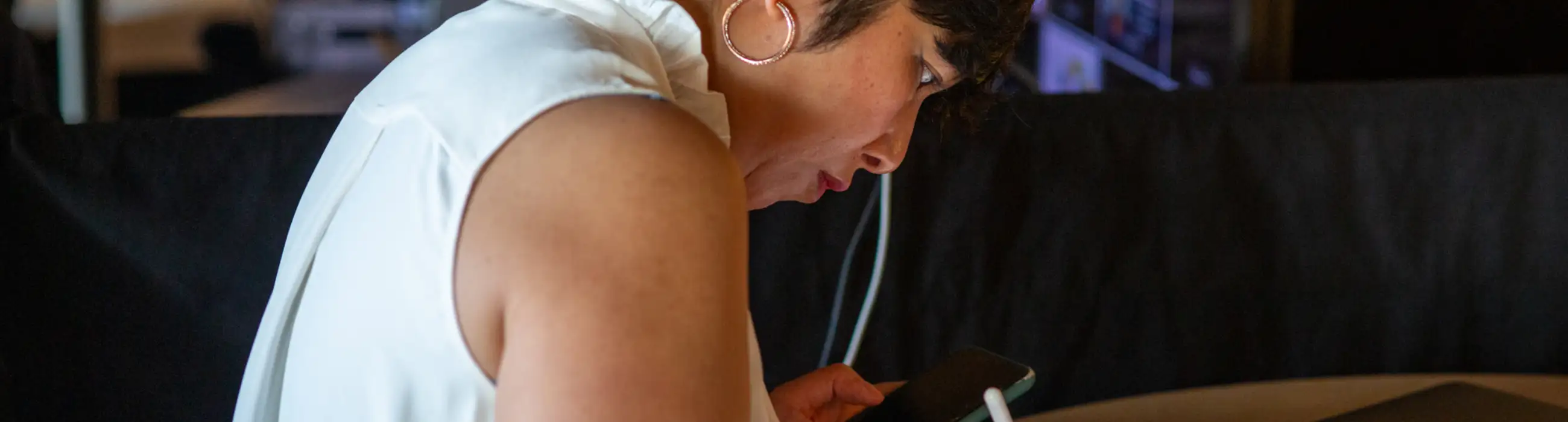 Person writing on a tablet