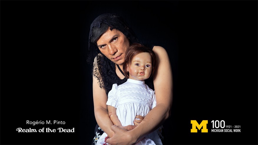 TEXT: Realm of The Dead, Rogerio Pinto, Block M, Michigan Social Work 100 IMAGE: Rogerio Pinto styled as his mother holding a doll.