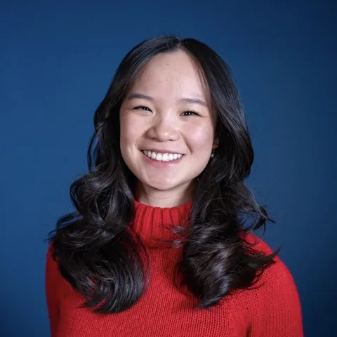 photo of Angela Chin in red turtleneck sweater