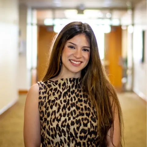 Photo of Eliza Galvez standing in a hallway