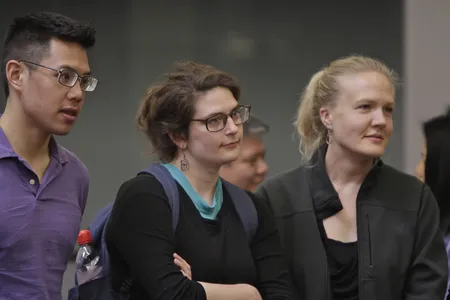 Three PhD students listening