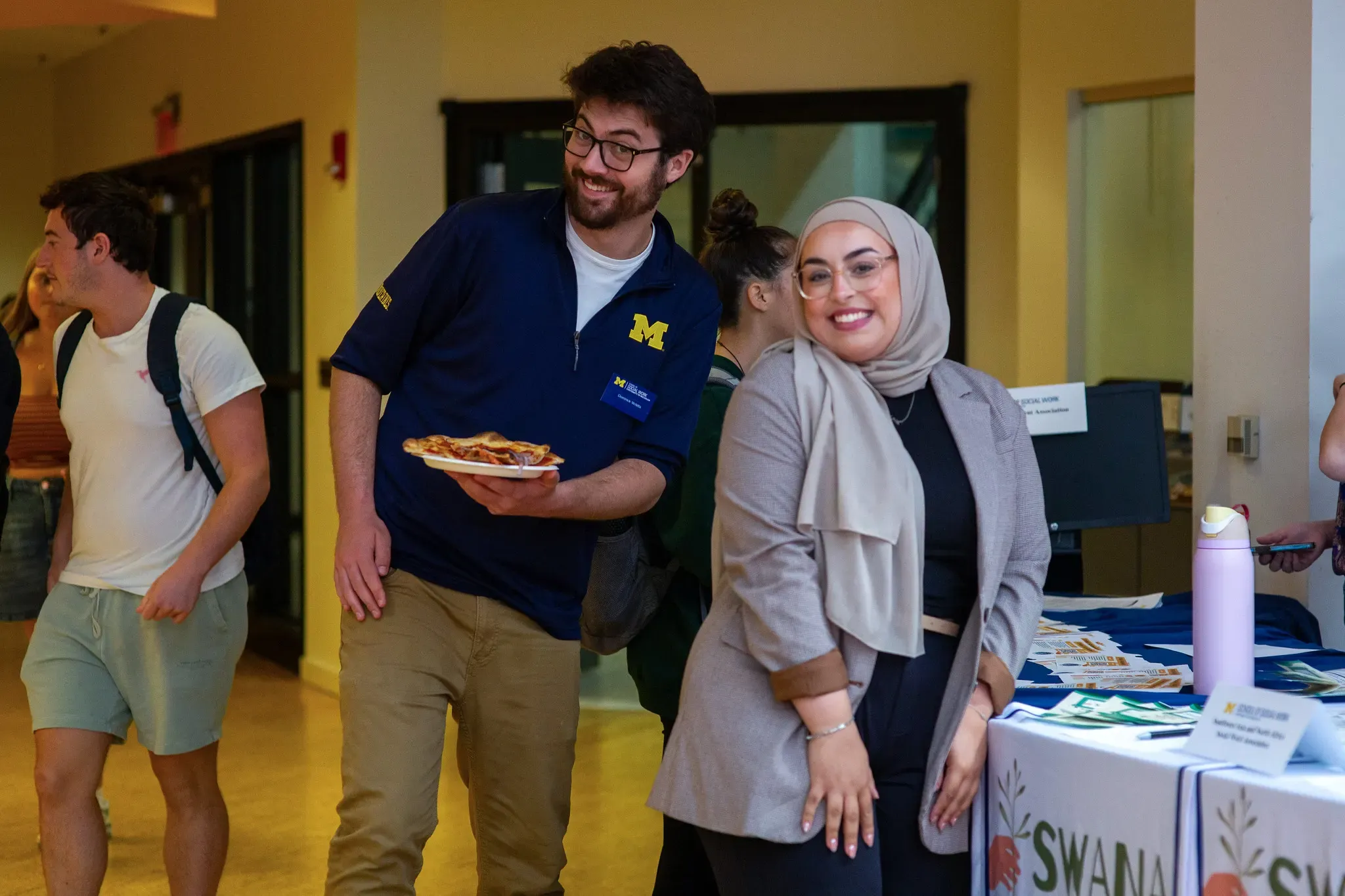 Two students posing with food.